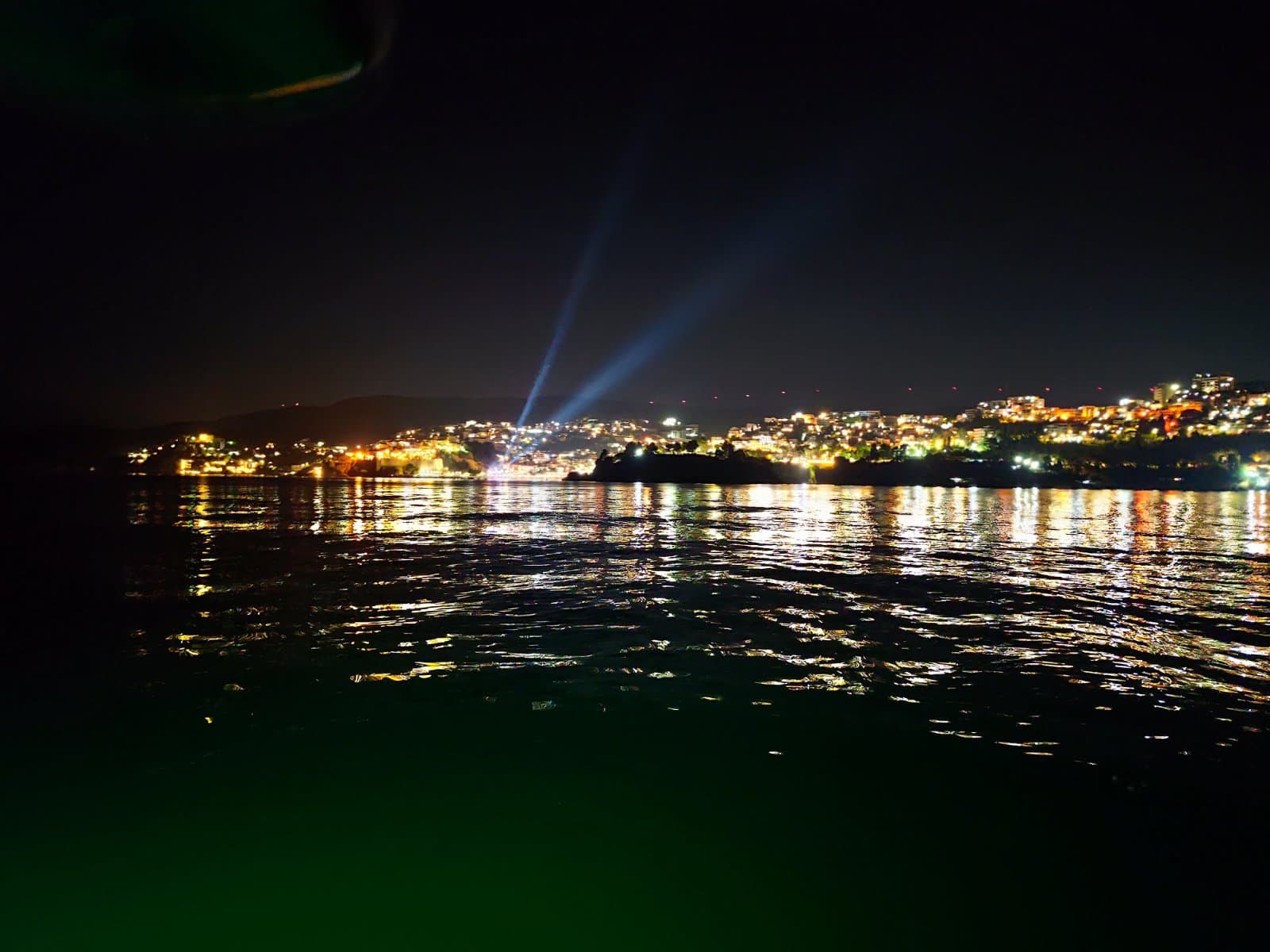 Wide nighttime view of the bay from the boat