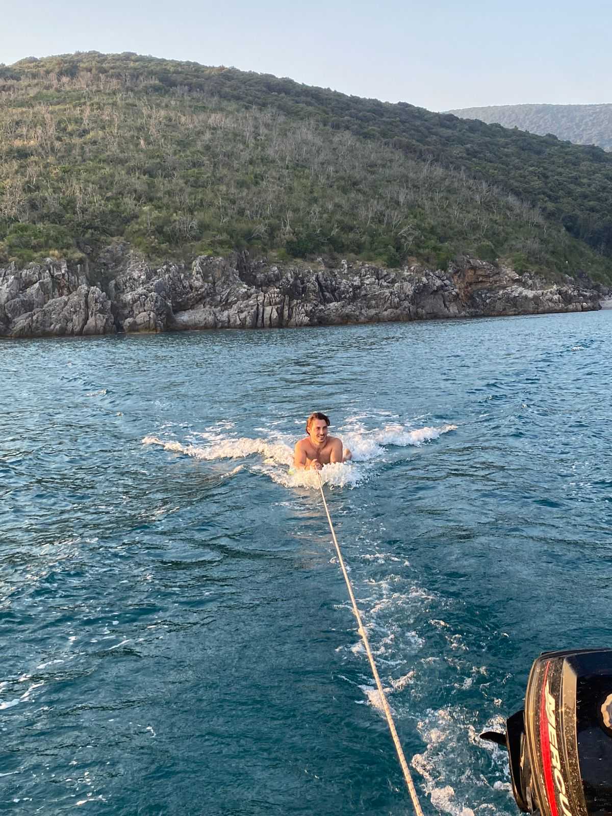 Swimmer being towed through clear Adriatic water