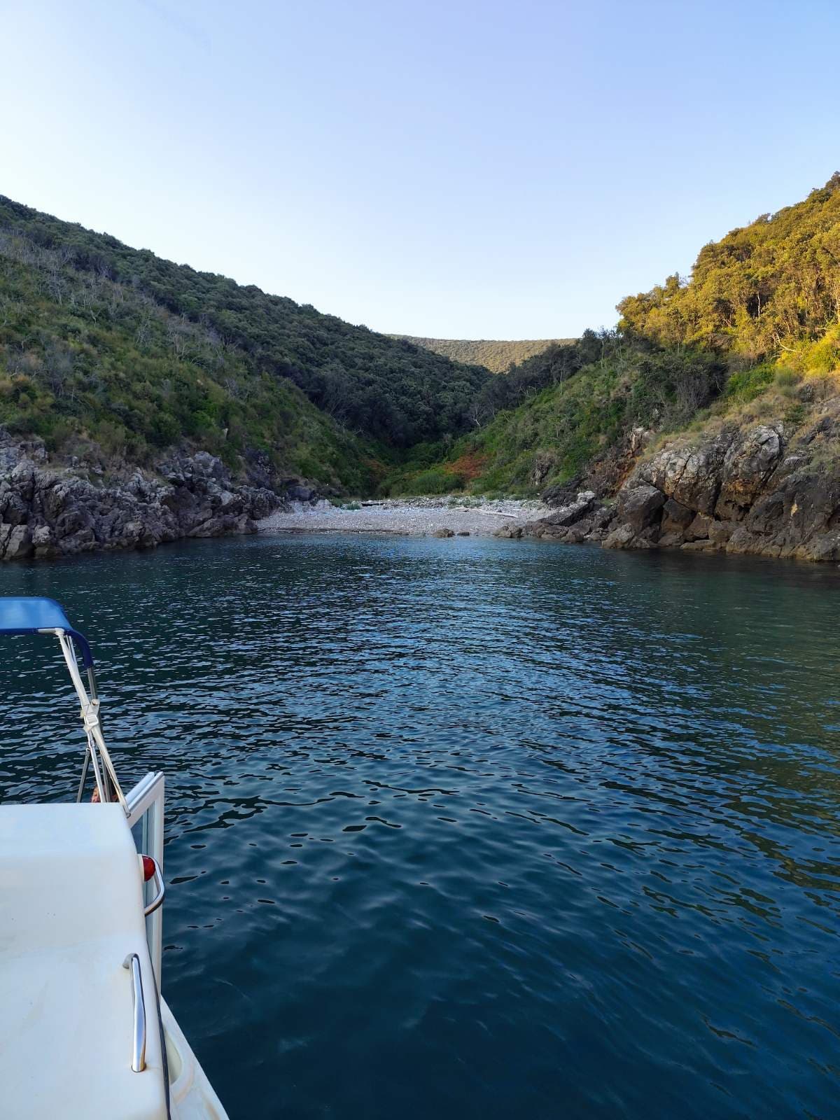 Quiet bay seen from the bow of the boat
